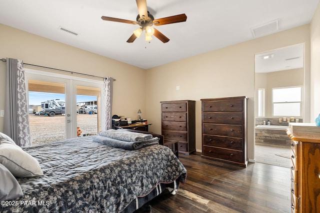 bedroom featuring ceiling fan, access to exterior, dark wood-type flooring, and multiple windows