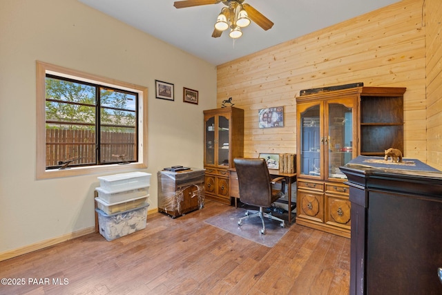 5278 N Saddleback Dr, Prescott Valley, AZ 86314 - office with wooden walls, baseboards, ceiling fan, and light wood-type flooring