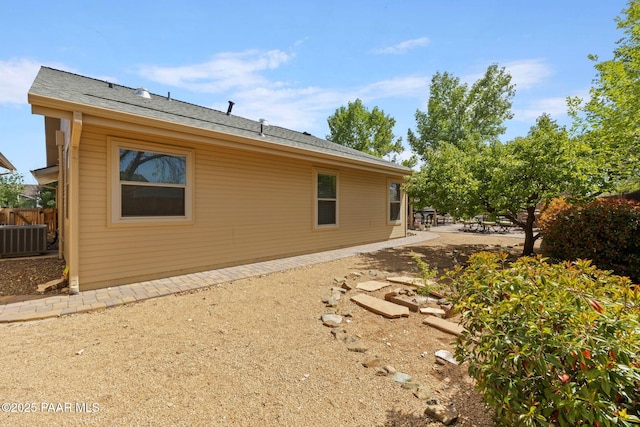 5278 N Saddleback Dr, Prescott Valley, AZ 86314 - back of house with central air condition unit, fence, and a patio area