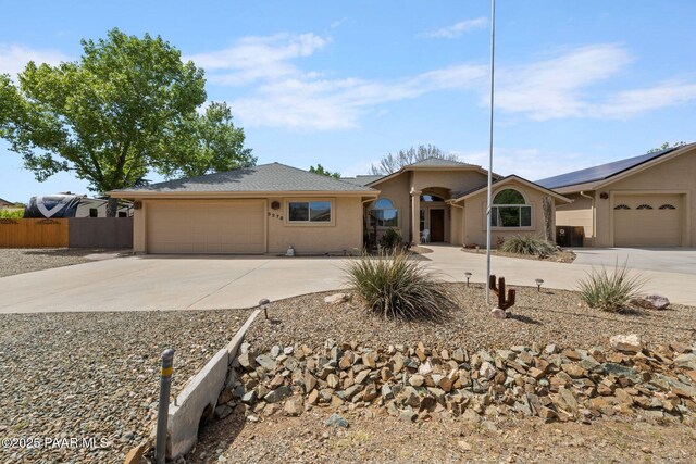 5278 N Saddleback Dr, Prescott Valley, AZ 86314 - single story home with concrete driveway, fence, stucco siding, and a garage