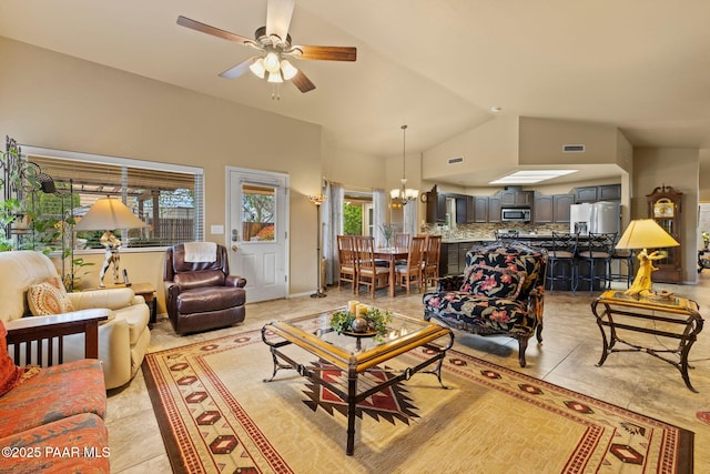 5278 N Saddleback Dr, Prescott Valley, AZ 86314 - living room with high vaulted ceiling, visible vents, light tile patterned floors, and ceiling fan with notable chandelier