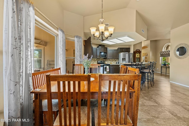 5278 N Saddleback Dr, Prescott Valley, AZ 86314 - dining area with visible vents, lofted ceiling, baseboards, a chandelier, and light tile patterned floors