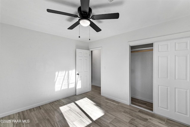 unfurnished bedroom with ceiling fan, a closet, and light hardwood / wood-style flooring