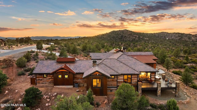 view of front of house featuring a mountain view and cooling unit