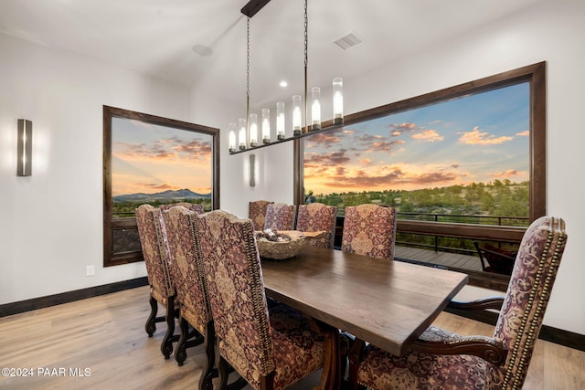 dining space with light hardwood / wood-style flooring