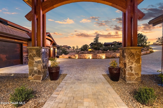 view of patio terrace at dusk