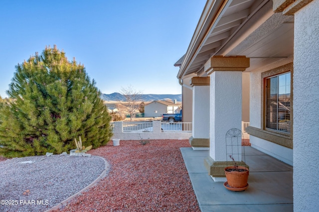 view of yard with a patio and a mountain view