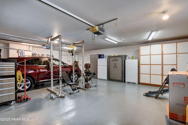 garage featuring a garage door opener and white refrigerator