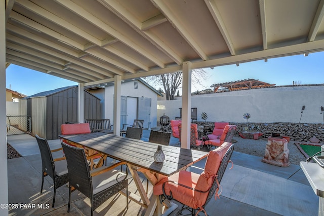 view of patio with a storage shed