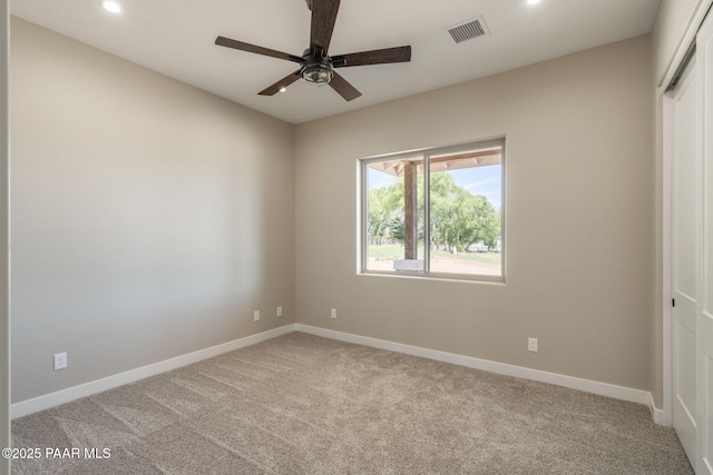 spare room with recessed lighting, light carpet, baseboards, and ceiling fan