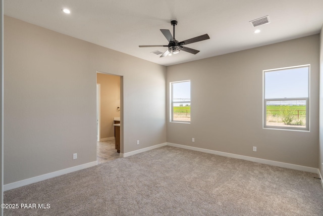 unfurnished room featuring light colored carpet, ceiling fan, baseboards, and recessed lighting
