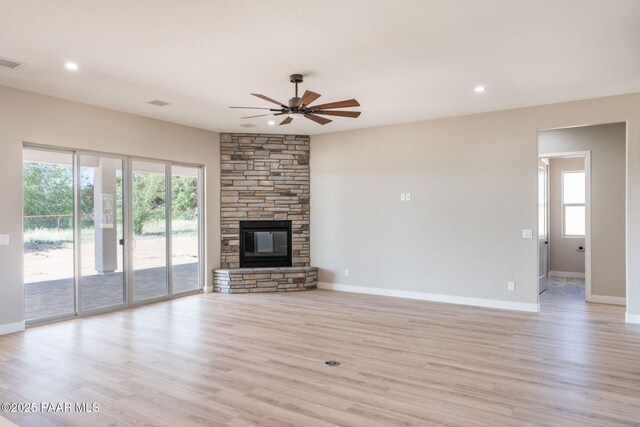 unfurnished living room featuring ceiling fan, light wood-type flooring, baseboards, and recessed lighting