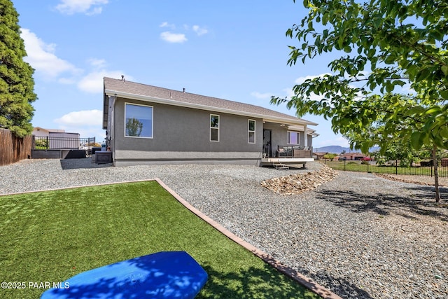 7921 E Las Palmas Dr, Prescott Valley, AZ 86314 - back of property featuring stucco siding, central air condition unit, and a patio area