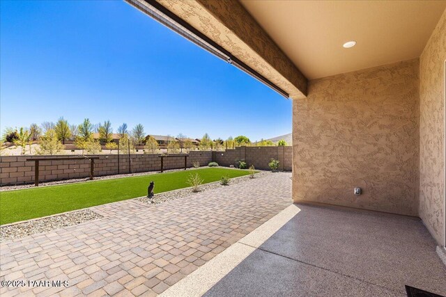 view of patio with a fenced backyard