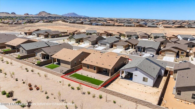 birds eye view of property featuring a mountain view and a residential view