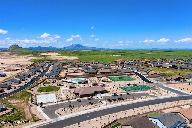 birds eye view of property featuring a mountain view and a residential view