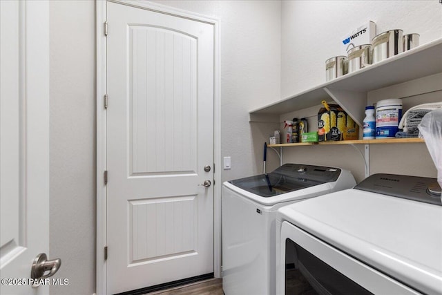 washroom with washer and clothes dryer and laundry area