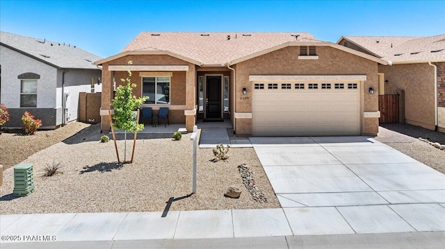 ranch-style home with a garage, covered porch, concrete driveway, and stucco siding