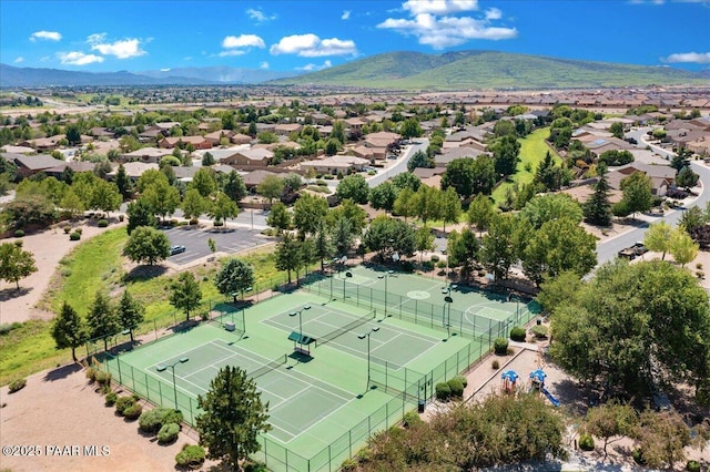 drone / aerial view featuring a residential view and a mountain view