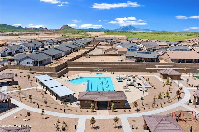 birds eye view of property with a mountain view and a residential view