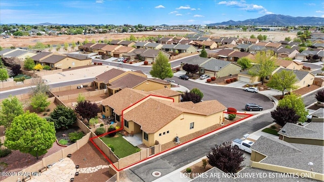 aerial view with a mountain view and a residential view