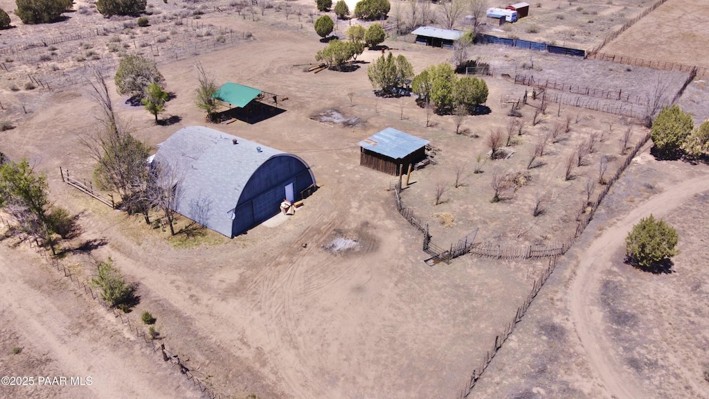 drone / aerial view with a desert view and a rural view