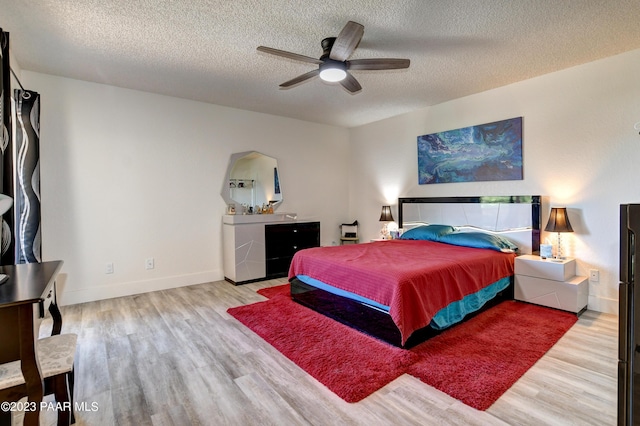 3096 Montana Dr, Prescott, AZ 86301 - bedroom with baseboards, a ceiling fan, a textured ceiling, and wood finished floors