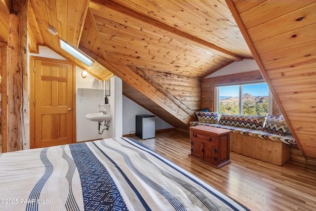 bedroom with sink, wood-type flooring, wooden ceiling, log walls, and vaulted ceiling with skylight