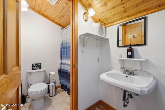 bathroom featuring lofted ceiling, toilet, wooden ceiling, curtained shower, and tile patterned flooring