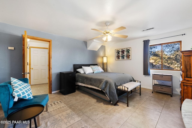 tiled bedroom with ceiling fan