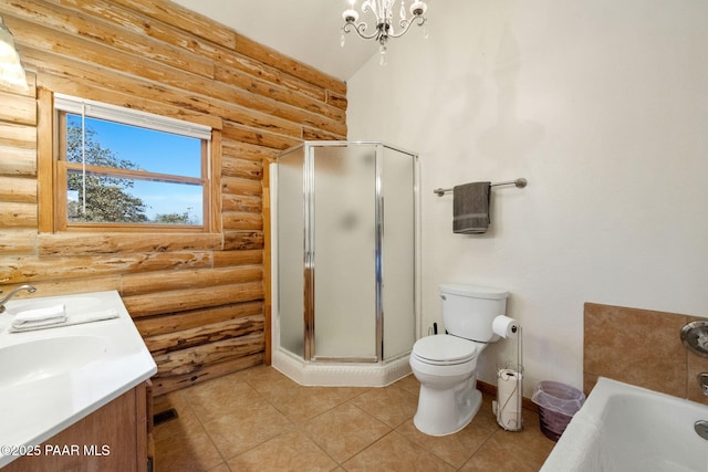 full bathroom featuring independent shower and bath, vanity, toilet, tile patterned floors, and an inviting chandelier