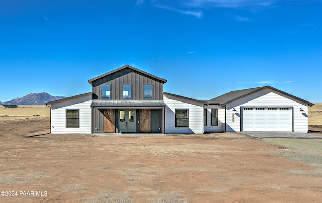 view of front of house featuring a mountain view and a garage