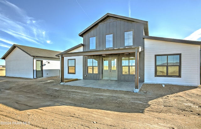 rear view of property featuring a patio