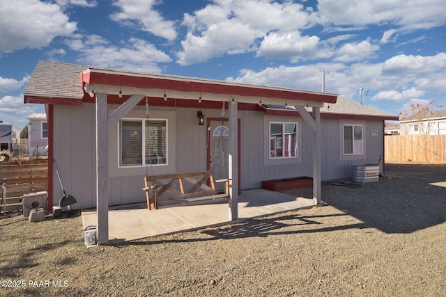 rear view of house featuring a patio