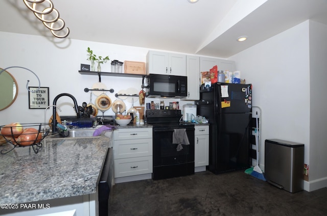 kitchen with black appliances, white cabinets, light stone countertops, and sink