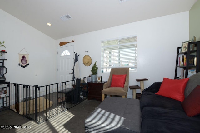 living room featuring lofted ceiling