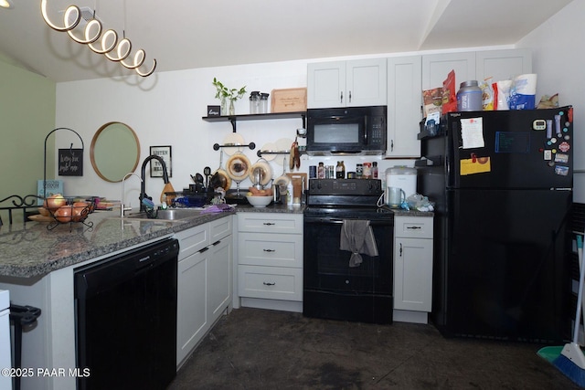 kitchen featuring black appliances, white cabinetry, dark stone countertops, sink, and kitchen peninsula