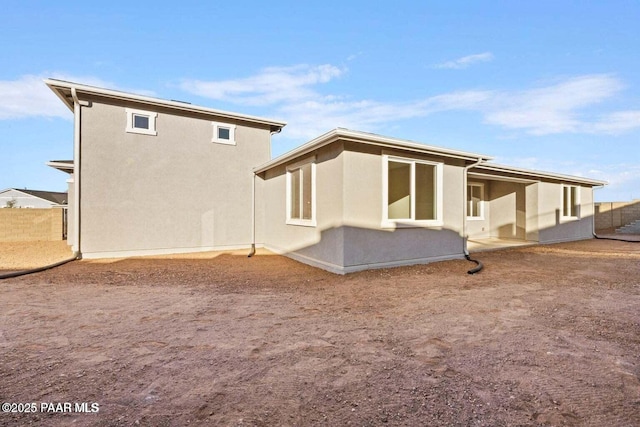 8595 N Isabella Ct, Prescott Valley, AZ 86315 - rear view of house with a patio, stucco siding, and fence