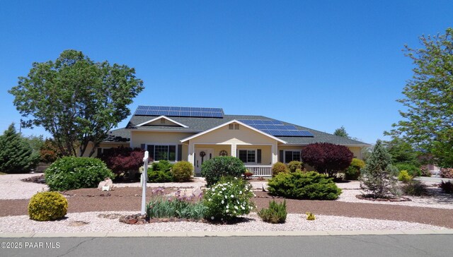 987 Kristin St, Chino Valley, AZ 86323 - view of front facade featuring roof mounted solar panels and a porch