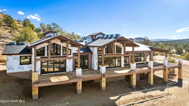 rear view of property with a mountain view