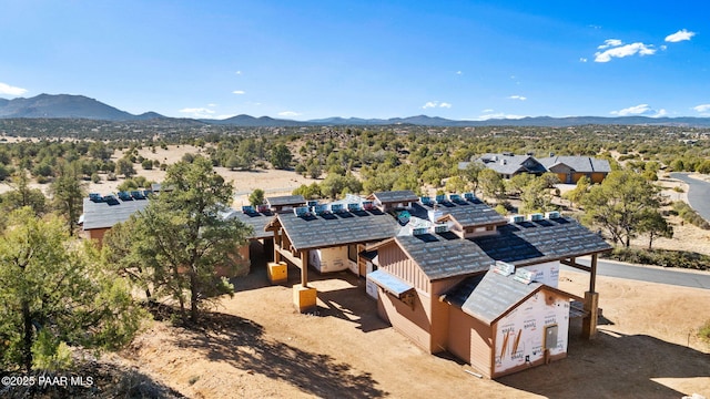 birds eye view of property with a mountain view