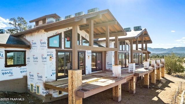 rear view of property with a mountain view