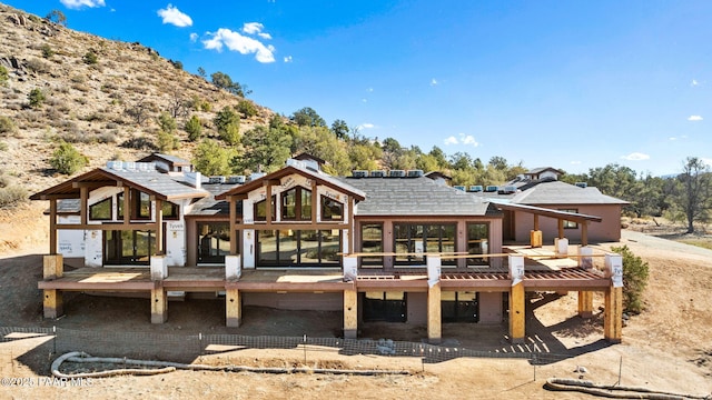 rear view of property with a deck