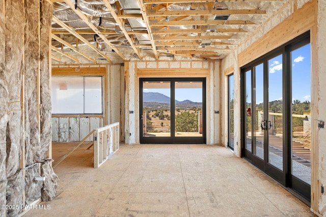 misc room featuring a mountain view and french doors