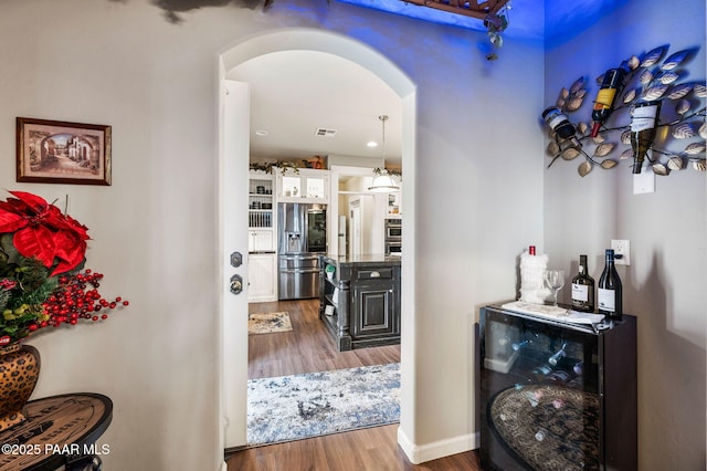 930 S Kerasi Ct, Dewey-Humboldt, AZ 86327 - corridor featuring arched walkways and wood finished floors