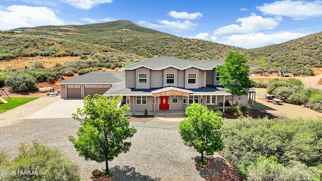 930 S Kerasi Ct, Dewey-Humboldt, AZ 86327 - traditional-style home featuring concrete driveway, covered porch, a mountain view, and an attached garage