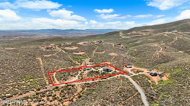 930 S Kerasi Ct, Dewey-Humboldt, AZ 86327 - aerial overview of property's location featuring a mountainous background and property boundaries highlighted