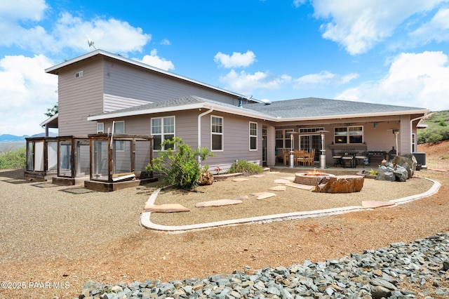 930 S Kerasi Ct, Dewey-Humboldt, AZ 86327 - back of property featuring a fire pit and a patio