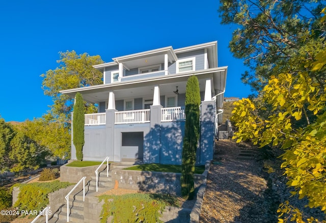 view of front of property with a balcony