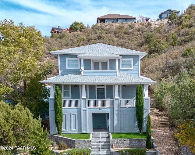 view of front facade featuring a porch and a garage